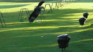golf clubs on driving range